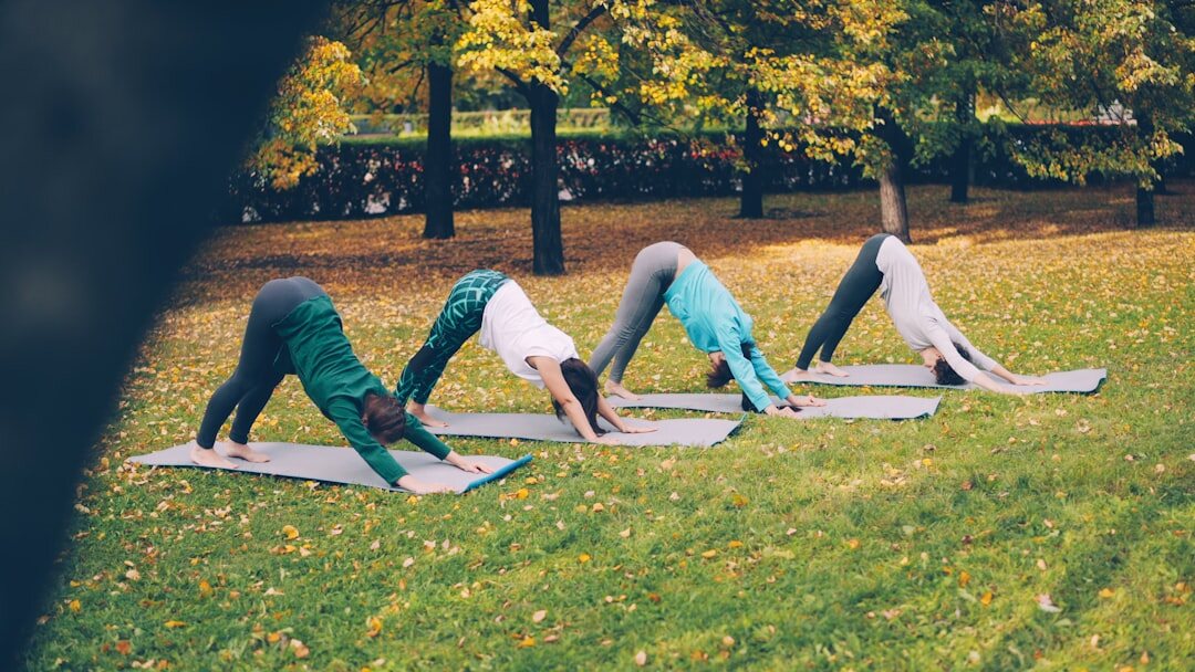seniors doing yoga outdoors