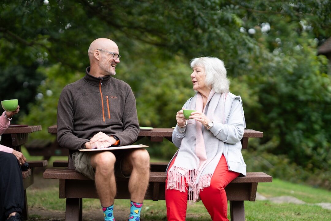 Group of happy Slovak seniors laughing together outdoors in a park